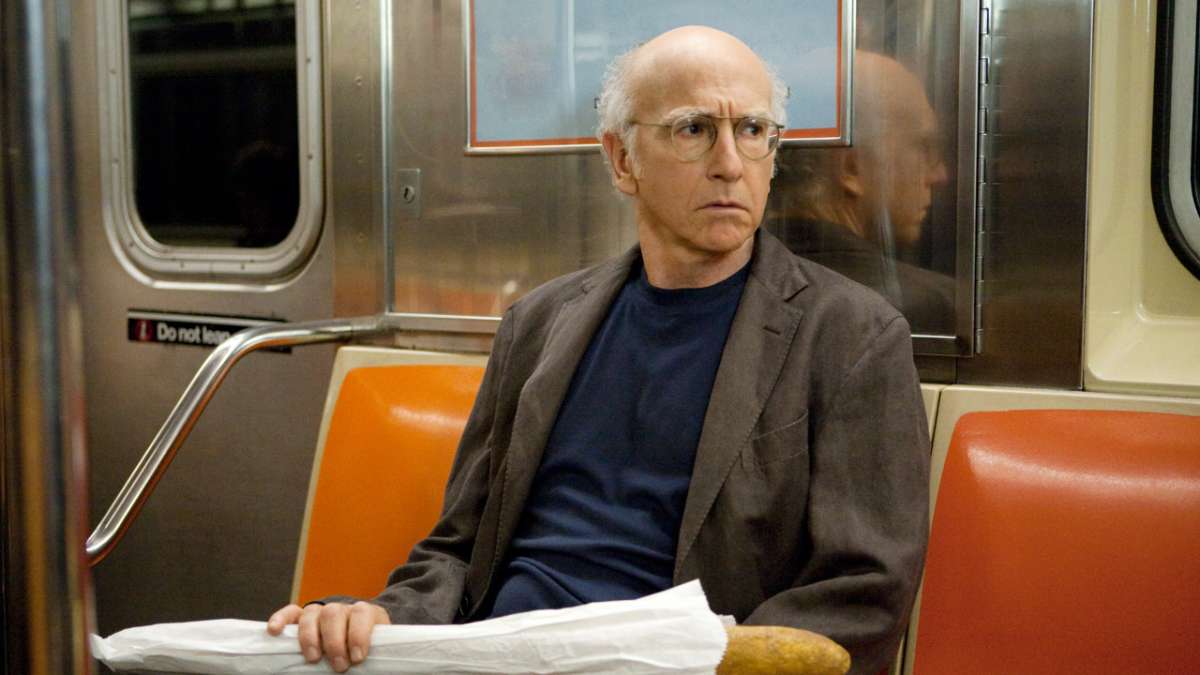Larry on subway with bread loaf